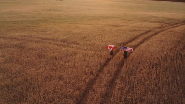 Top view of the canadian flag and the us flag next to it. The concept of friendship and partnership