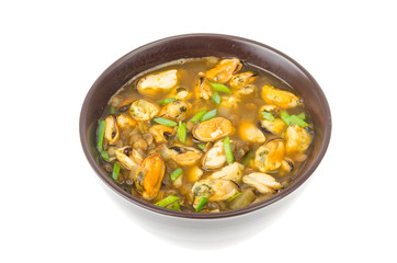 Hot spicy soup with mussels and vegetables