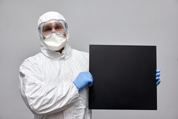 Man in protection suit and empty card