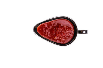 Metal bowl of ketchup isolated on white background