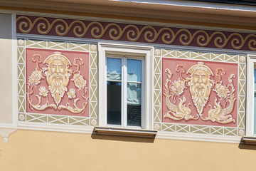 Italian window on the stylish and beautiful coloreful pattern on the wall facade