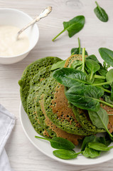 Vegetarian pancakes, served with yogurt and Spinach