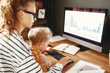 Boy and mother about data analysis during work.