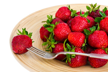 Ripe sweet farmer red strawberries on wooden dish