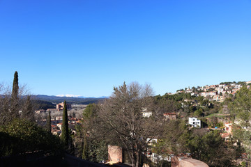 View of Girona from the city fortress against the backdrop of snow-capped mountains, Catalonia, Spain