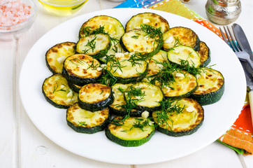 Grilled zucchini with garlic and herbs. Photo
