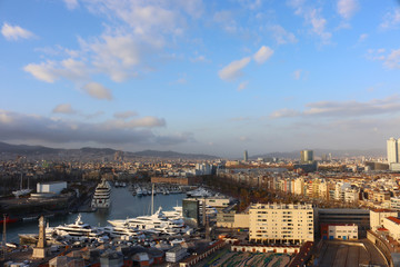 View of the evening Barcelona and the bay with yachts from the cable car, Catalonia, Spain, aerial view - obrazy, fototapety, plakaty
