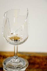 a broken glass of liqueur