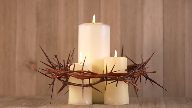 3 Lit Candles surrounded by Crown of Thorns. Communion