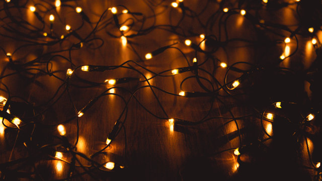 Full Frame Shot Of Illuminated Christmas Lights In Dark