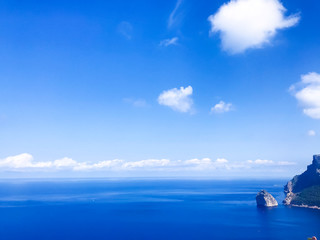 Sea, blue sky, white clouds on sunny day