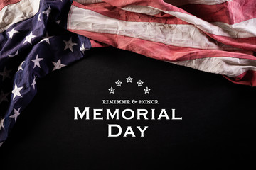 Happy Memorial Day. American flags with the text REMEMBER & HONOR against a blackboard background. May 25.
