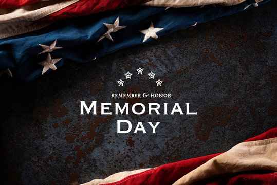 Happy Memorial Day. American flags with the text REMEMBER & HONOR against a black stone texture background. May 25.