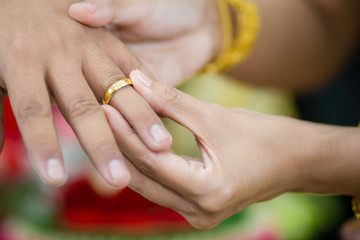 The ring on bride's finger in wedding ceremony wedding thailand