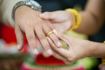 Obraz na płótnie Canvas The ring on bride's finger in wedding ceremony wedding thailand