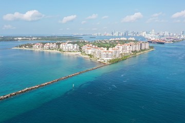 Naklejka na ściany i meble Aerial view of Fisher Island and Government Cut, Florida during COVID-19 stay-at-home order on clear sunny morning.
