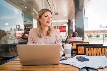 Young businesswoman working on her laptop.