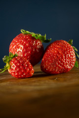 Closeup of three fresh and ripe strawberries
