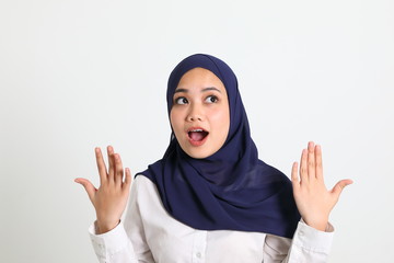 South east Asian Malay Woman headscarf facial expression surprised