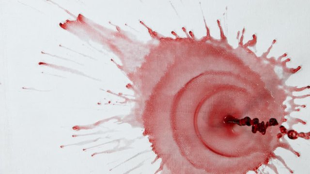 Super Slow Motion Top Shot of Splashing Red Wine on White Cloth at 1000fps.