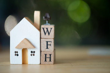 Miniature chair put on wood block WFH with wood home