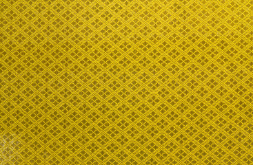 Golden woven fabric for background or texture.