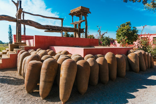 Old grape mill and clay still life for wine at Hacienda Tacama, Ica Peru