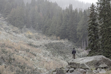 Autumn Snow in a Mountain with a man meditating
