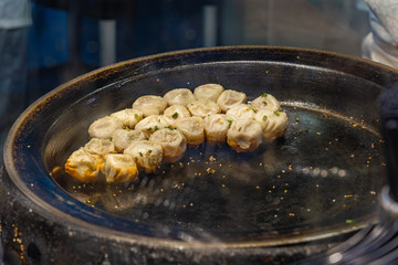 Singapore food court- delicious fried dumplings on hot pan