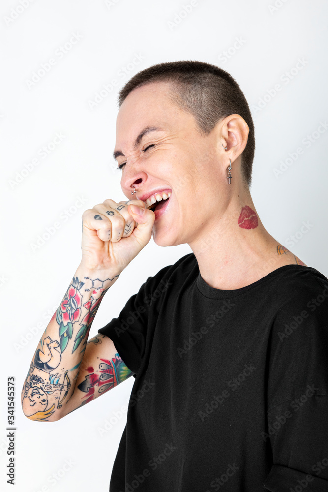 Wall mural cool skinhead tattooed woman laughing