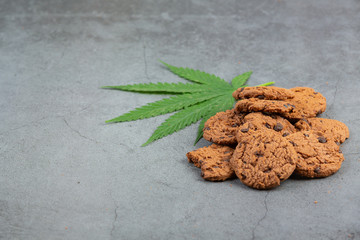 Chocolatechip cookies is isolated with marijuana on white background.
