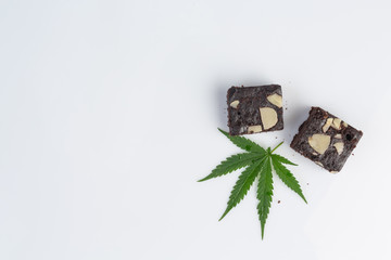 Pot brownies with marijuana leaf  on white background.