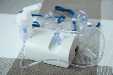 Medical equipment for inhalation with respiratory mask, nebulizer.  Asthma breathing treatment. Bronchitis, asthmatic health equipment.