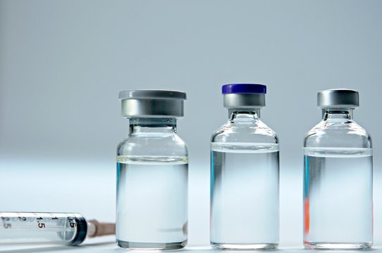 Medicine in vials , ready for vaccine injection , Cancer Treatment , Pain Treatment and can also be abused for an illegal use, healthcare and medical concept vaccination.