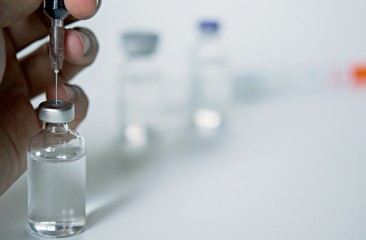 Vaccine vial dose flu shot drug needle syringe,medical concept vaccination hypodermic injection treatment disease care hospital prevention immunization illness disease baby child