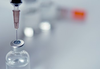 Vaccine vial dose flu shot drug needle syringe,medical concept vaccination hypodermic injection treatment disease care hospital prevention immunization illness disease baby child