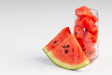 Freshly sliced watermelon juice on a white background