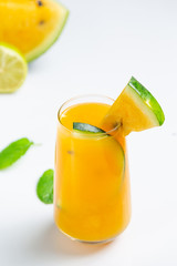 Yellow watermelon juice in white background