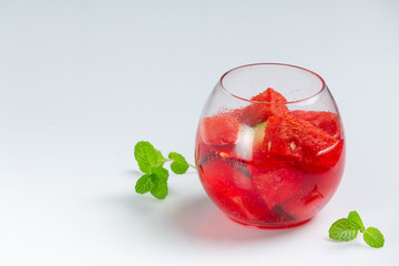 Freshly sliced watermelon juice on a white background