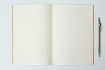 Top view of Pen, notebook  on white background