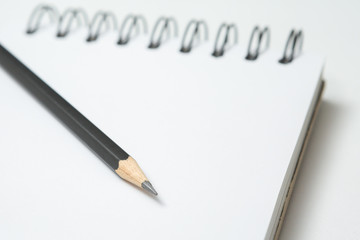 Selective focus of Pencils and notepads  on white background