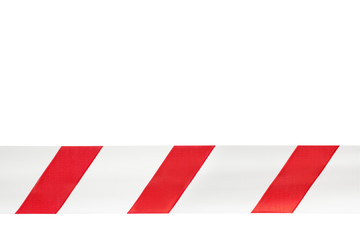 One red and white warning tape on an isolated white background. Concept for protecting people from coronavirus infection. Coronavirus, Covid-19