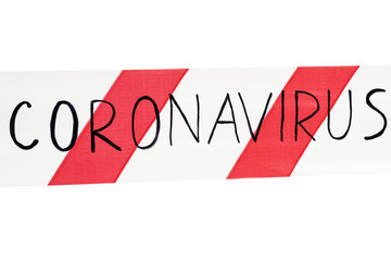 Fototapeta premium Red and white warning tape with information coronavirus on an isolated white background Concept for protecting people from coronavirus infection. Coronavirus, Covid-19