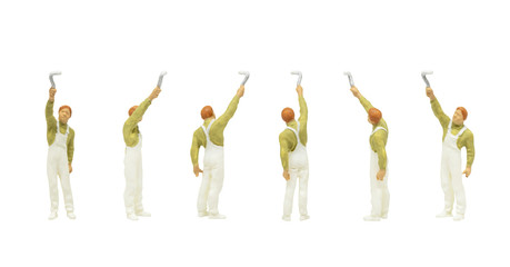 Miniature people character as painter standing and working in posture isolated on white background.