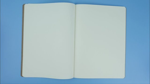 Open the book white page Blank for insert text and subtitles on blue background.
