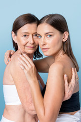 Happy mother and daughter hugging