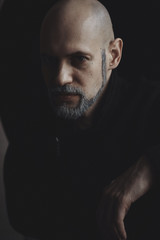 Male prtret bald man with a white beard
