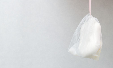 Soap and soft pink bath puff