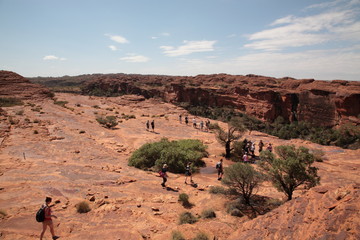 Tourists hiking in Kings Canyon National Park outback central Australia.