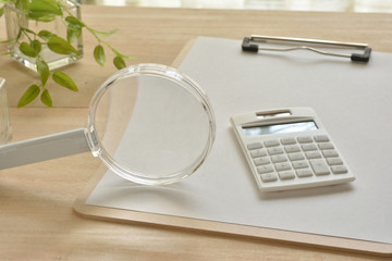 Magnifying glass and calculator